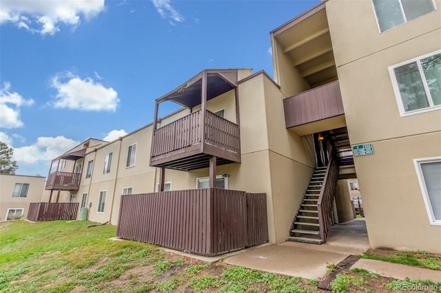 9725 E Harvard Ave Unit 317, Denver, CO 80231 - view of building exterior with stairs