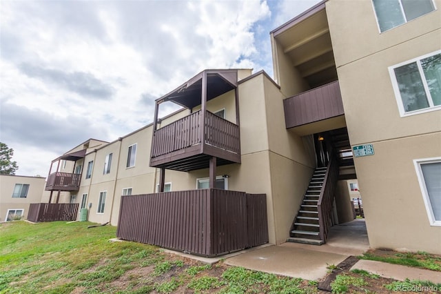 9725 E Harvard Ave Unit 317, Denver, CO 80231 - view of building exterior with stairway