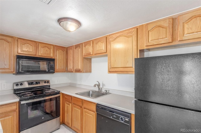 9725 E Harvard Ave Unit 317, Denver, CO 80231 - kitchen with black appliances, a sink, and light countertops