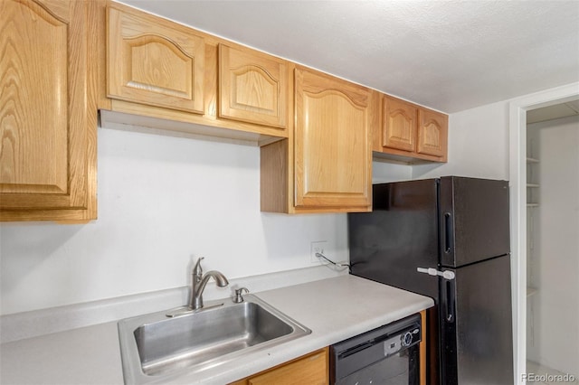 9725 E Harvard Ave Unit 317, Denver, CO 80231 - kitchen with black appliances, a sink, and light countertops