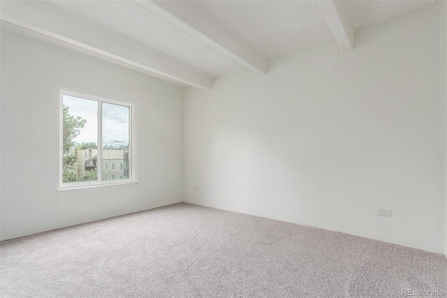 9725 E Harvard Ave Unit 317, Denver, CO 80231 - carpeted spare room featuring beam ceiling