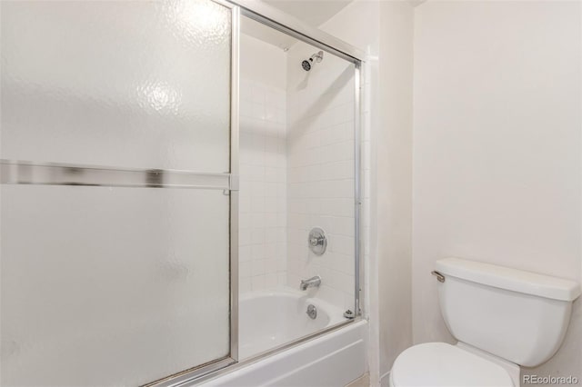 9725 E Harvard Ave Unit 317, Denver, CO 80231 - full bathroom featuring toilet and shower / bath combination with glass door