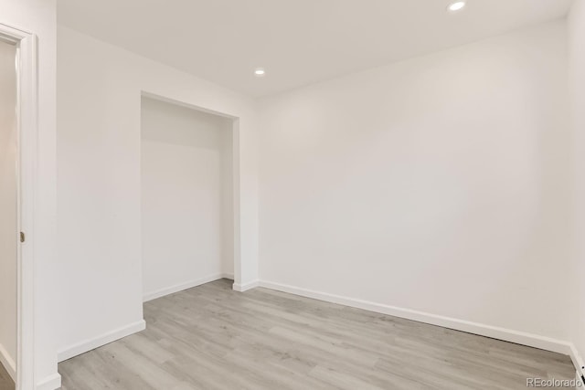 spare room featuring light hardwood / wood-style flooring