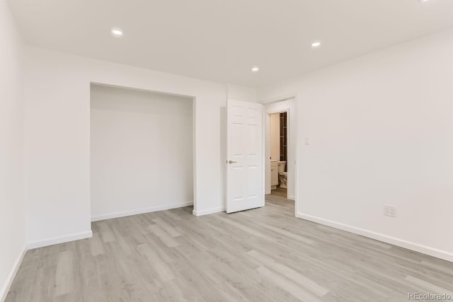 spare room featuring light hardwood / wood-style flooring