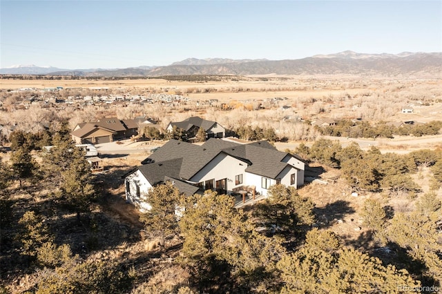 birds eye view of property with a mountain view