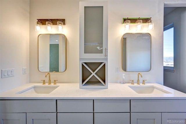 bathroom featuring double vanity and a sink