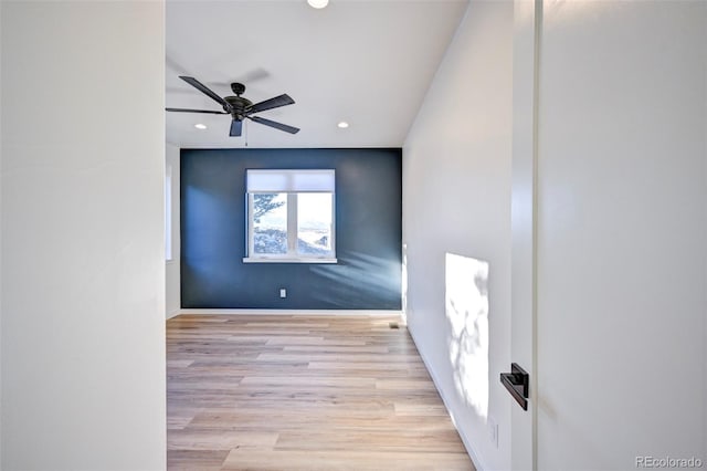 empty room featuring recessed lighting, wood finished floors, a ceiling fan, and baseboards