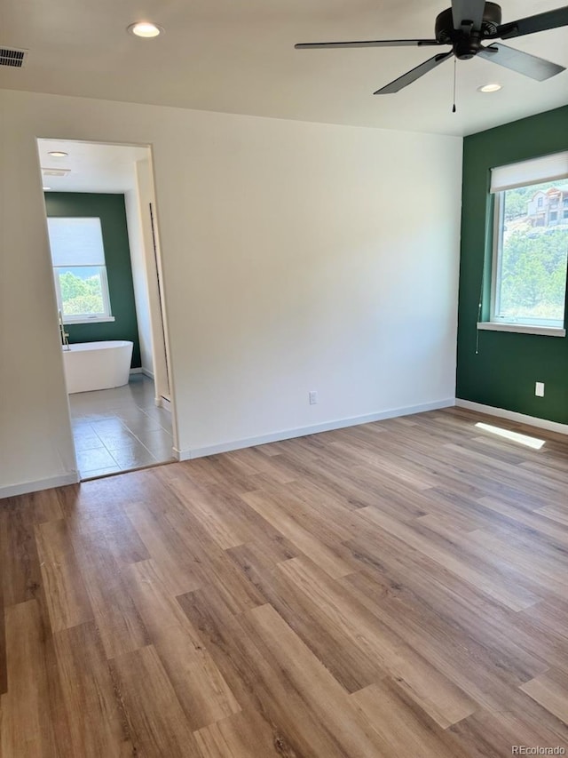 10373 Hutchinson Ln, Poncha Springs, CO 81242 - unfurnished room featuring plenty of natural light, a ceiling fan, wood finished floors, and recessed lighting