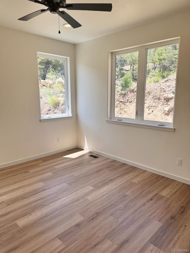 10373 Hutchinson Ln, Poncha Springs, CO 81242 - unfurnished room featuring a ceiling fan and light wood-style flooring