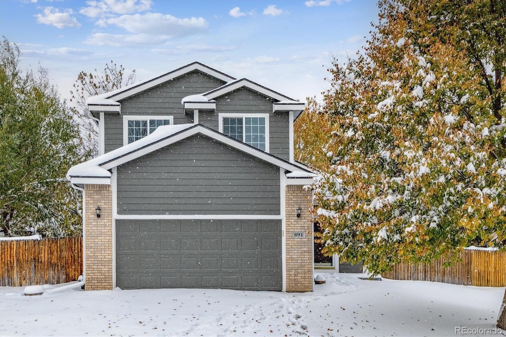 view of snow covered garage