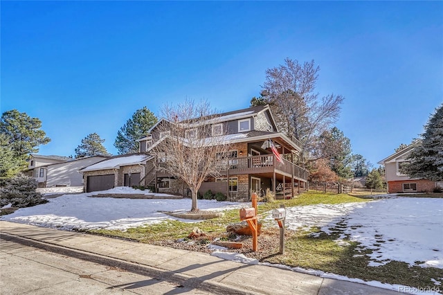 front facade featuring a garage and a deck