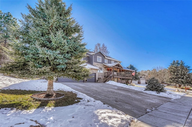 view of front of property with a garage and a deck