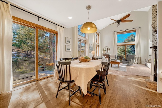 dining space with ceiling fan, plenty of natural light, and light wood-type flooring