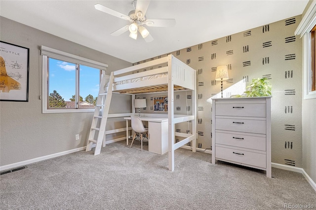 unfurnished bedroom featuring ceiling fan and light colored carpet