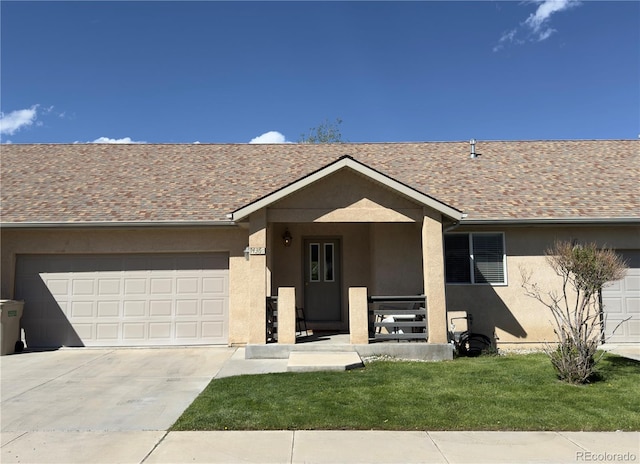 1436 H St Unit B, Salida, CO 81201 - single story home featuring stucco siding, a garage, concrete driveway, and a front lawn