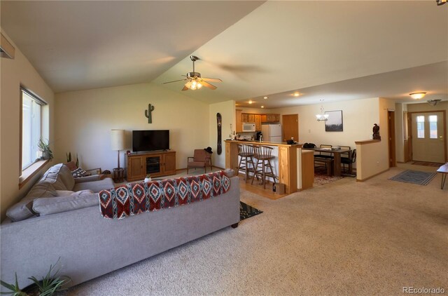 1436 H St Unit B, Salida, CO 81201 - living area with light colored carpet, vaulted ceiling, ceiling fan, and a chandelier