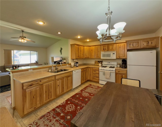 1436 H St Unit B, Salida, CO 81201 - kitchen featuring white appliances, a sink, a chandelier, a peninsula, and light countertops
