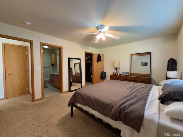 1436 H St Unit B, Salida, CO 81201 - bedroom featuring light carpet, ensuite bathroom, a spacious closet, ceiling fan, and a closet