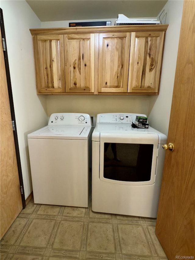 1436 H St Unit B, Salida, CO 81201 - washroom with washer and clothes dryer, cabinet space, and light flooring