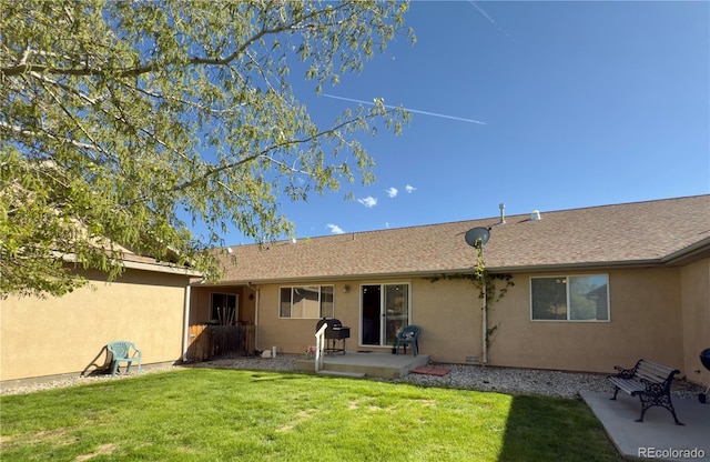 1436 H St Unit B, Salida, CO 81201 - back of property featuring stucco siding, a patio, and a lawn