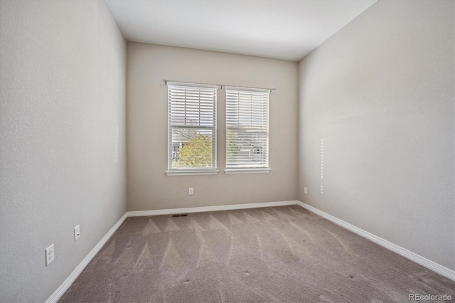 view of carpeted spare room