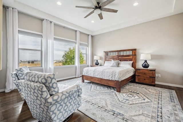 bedroom featuring ceiling fan and dark hardwood / wood-style flooring