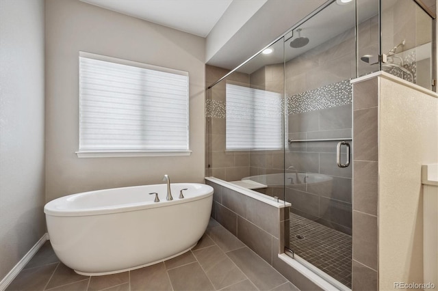 bathroom featuring tile patterned flooring and plus walk in shower