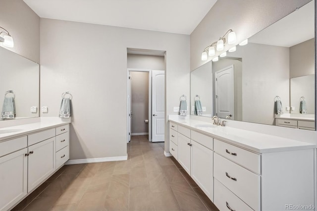 bathroom with vanity and tile patterned flooring