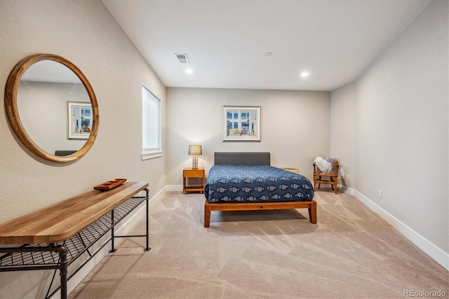 bedroom featuring light colored carpet