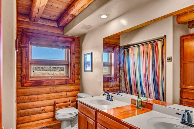 1528 Silverheels Rd, Fairplay, CO 80440 - full bath featuring rustic walls, wood ceiling with exposed beams, plenty of natural light, double vanity, and toilet