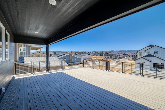 wooden deck with a residential view