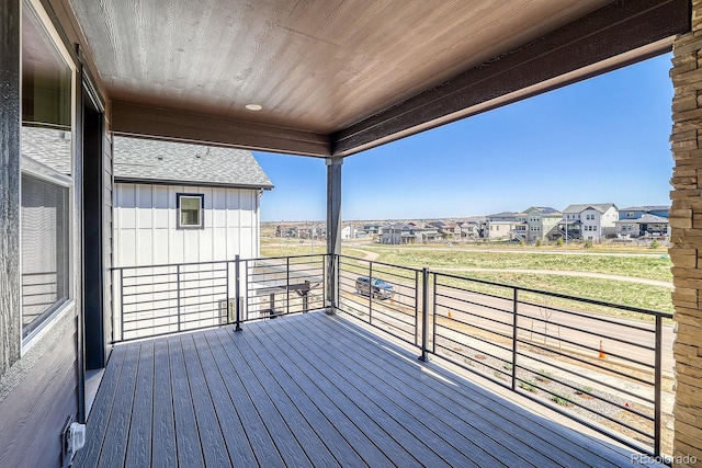 wooden terrace featuring a residential view