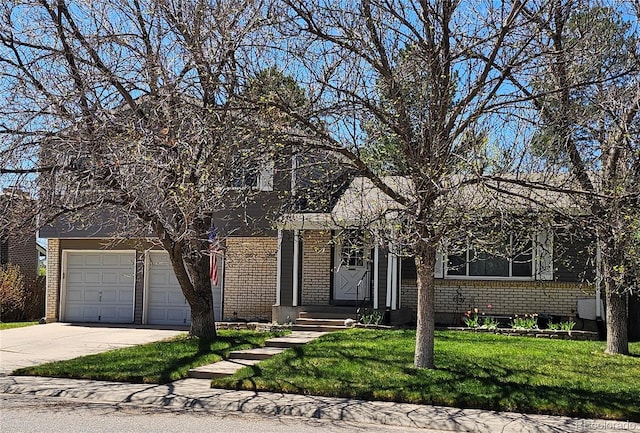 view of front of house with concrete driveway, a front lawn, and brick siding