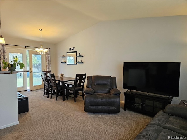 carpeted living room with vaulted ceiling, an inviting chandelier, and baseboards