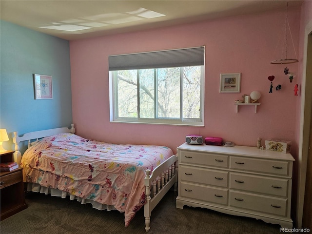 bedroom with dark carpet