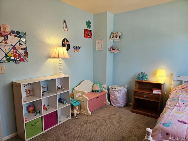 bedroom with baseboards and carpet floors