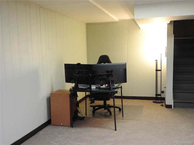 carpeted home office with baseboards