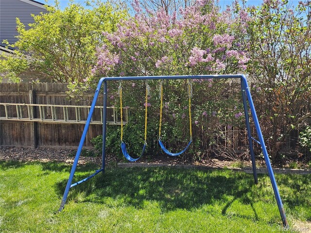 4609 S Kalispell Way, Aurora, CO 80015 - view of playground with fence and a lawn