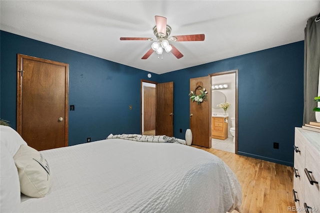 7563 Lamar Ct, Arvada, CO 80003 - bedroom featuring light wood-type flooring, ceiling fan, and ensuite bathroom
