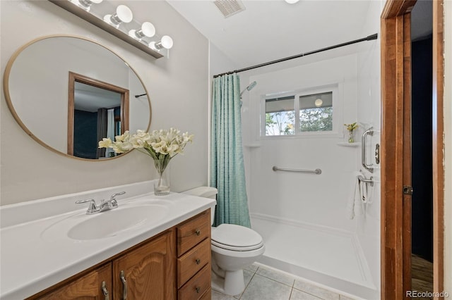 7563 Lamar Ct, Arvada, CO 80003 - bathroom with tile patterned flooring, vanity, and a shower with curtain