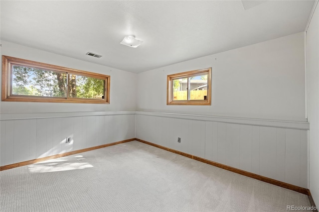 7563 Lamar Ct, Arvada, CO 80003 - carpeted spare room featuring plenty of natural light and wainscoting