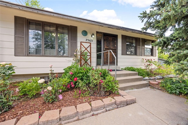 7563 Lamar Ct, Arvada, CO 80003 - property entrance featuring a porch