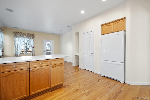 kitchen featuring light wood-type flooring and white refrigerator