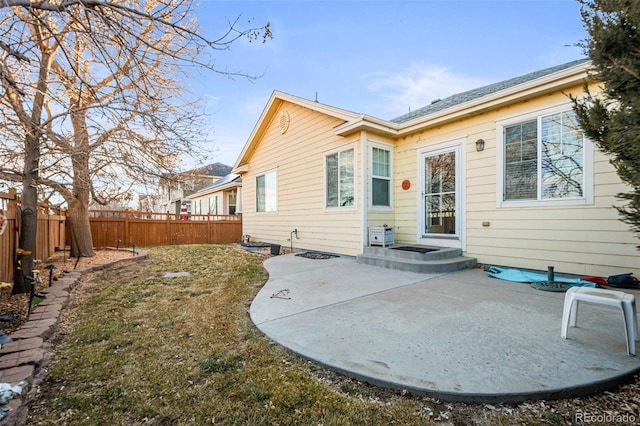 rear view of property featuring a patio