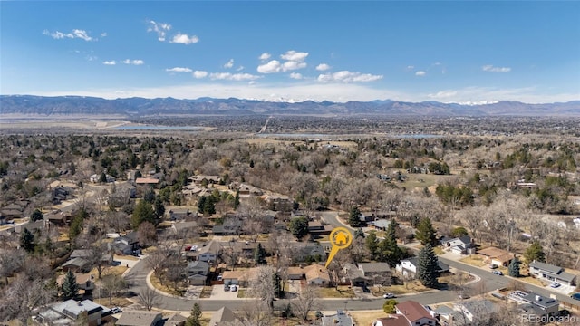 birds eye view of property featuring a mountain view