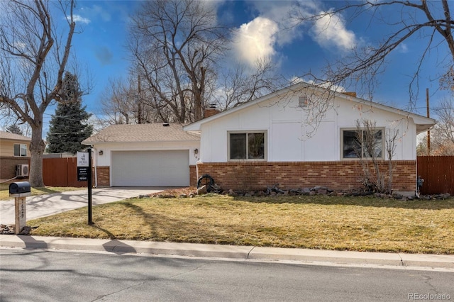 view of front of house with a garage, brick siding, driveway, and fence