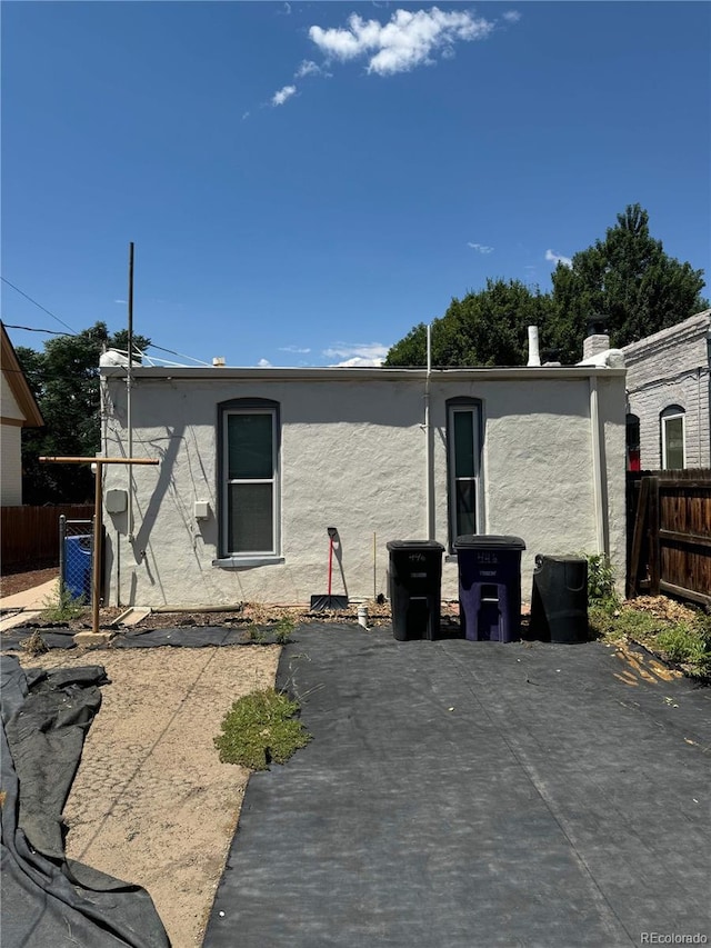 back of property with a patio