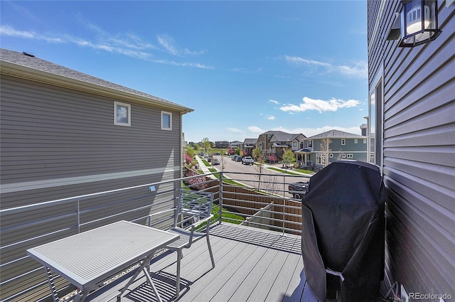 wooden terrace featuring grilling area