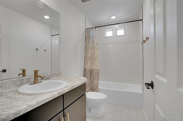 full bathroom featuring toilet, vanity, and shower / bath combo with shower curtain