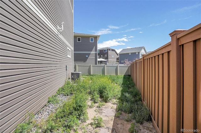 view of yard with central AC